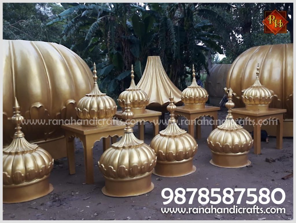 Assortment of golden domes and various religious handicraft products manufactured by Rana Handicrafts International