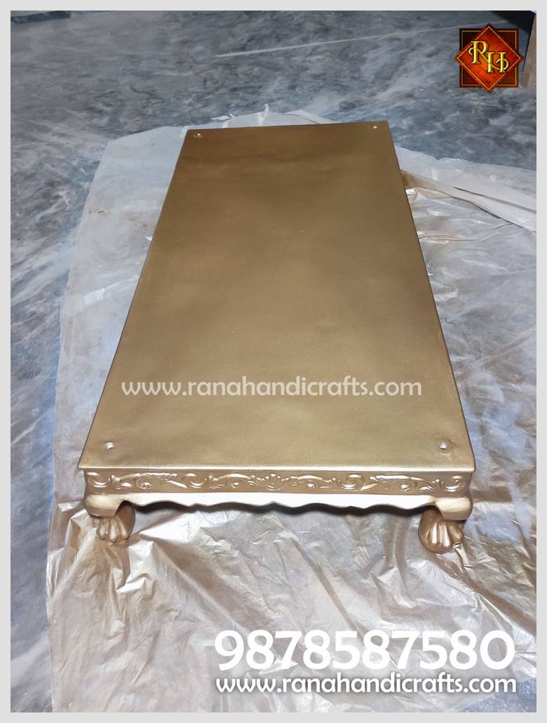 Base platform of the Palki Sahib featuring carved lion-paw feet and a custom golden finish.
