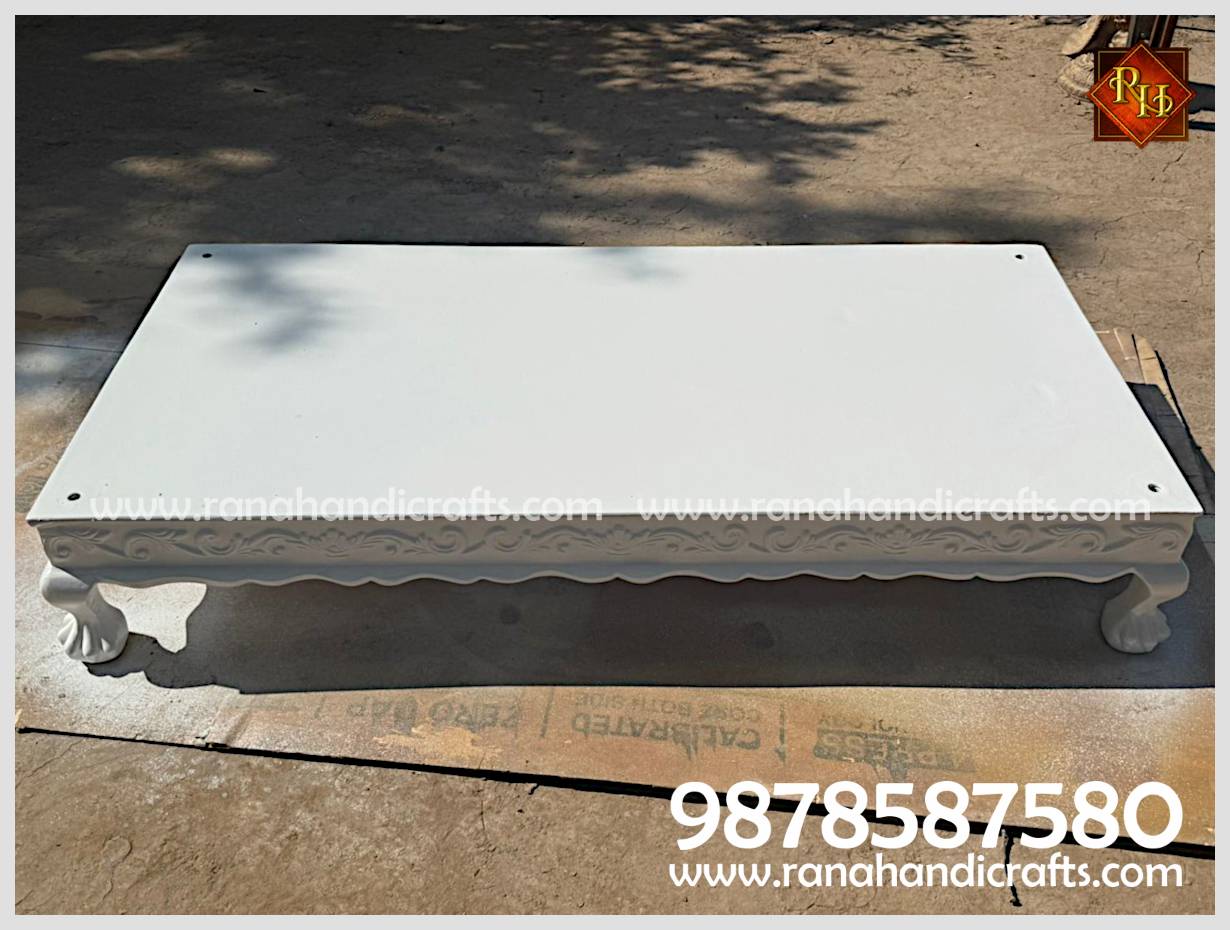 The base platform (Peeda Sahib) of the HM-03 Palki Sahib with lion-foot style legs and floral border carvings.