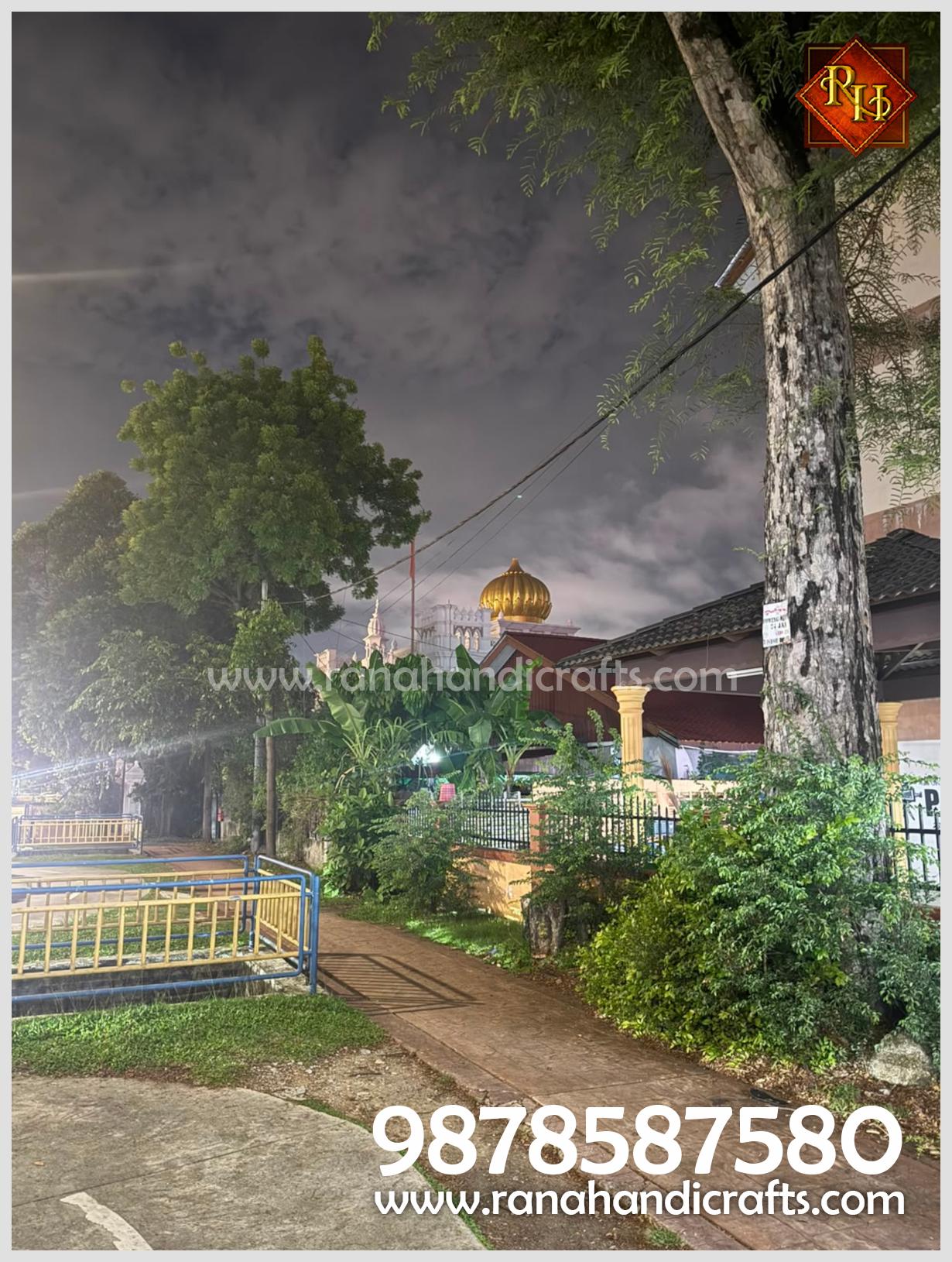 Nighttime view of the newly installed 20ft golden dome at Wadda Gurdwara Sahib, Penang, a project executed by Rana Handicrafts International featuring a durable silicon fiber and MS frame construction.