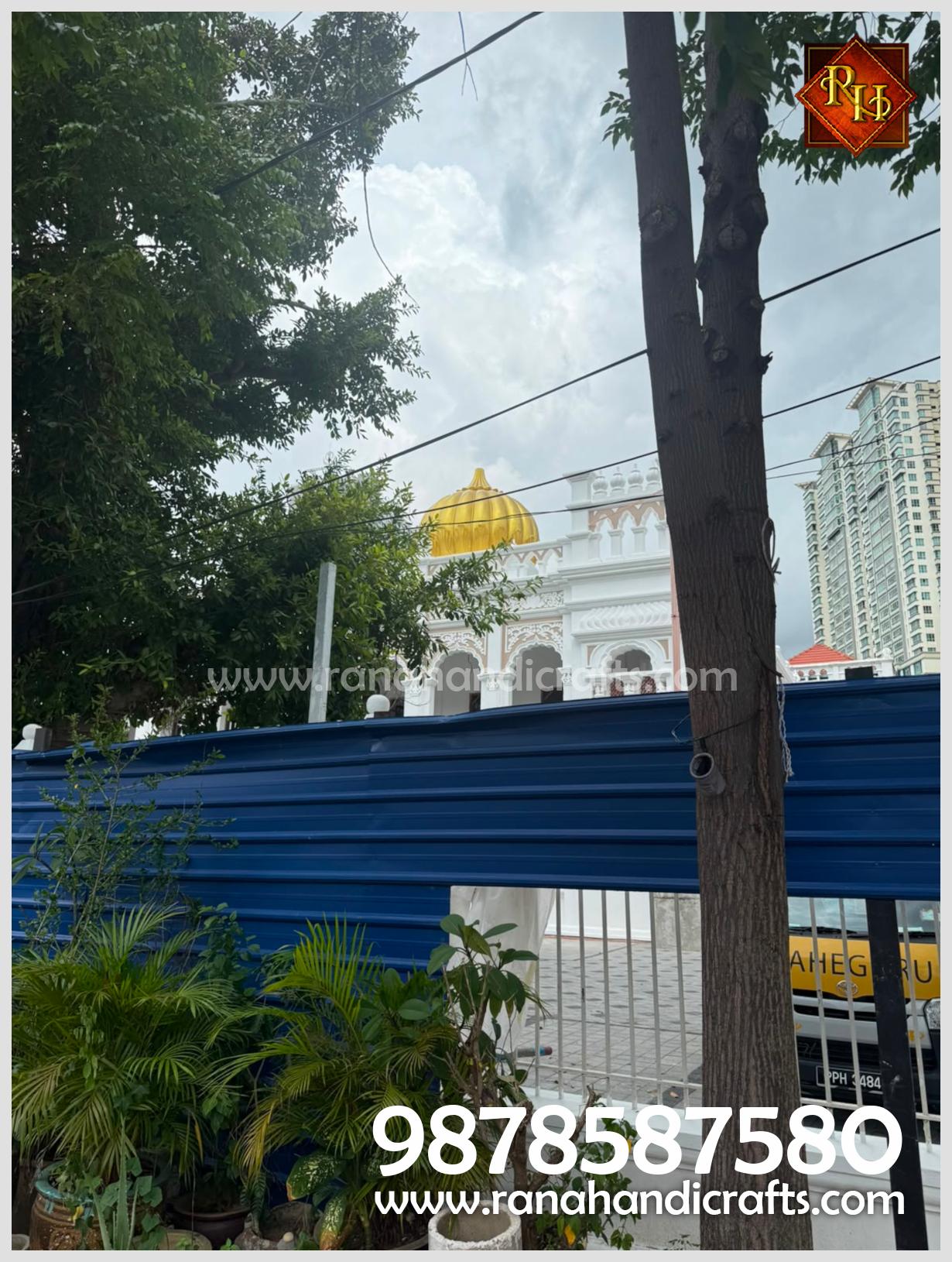 View of the golden dome at Wadda Gurdwara Sahib Penang from below, highlighting the quality of the silicon fiber material used by Rana Handicrafts International.