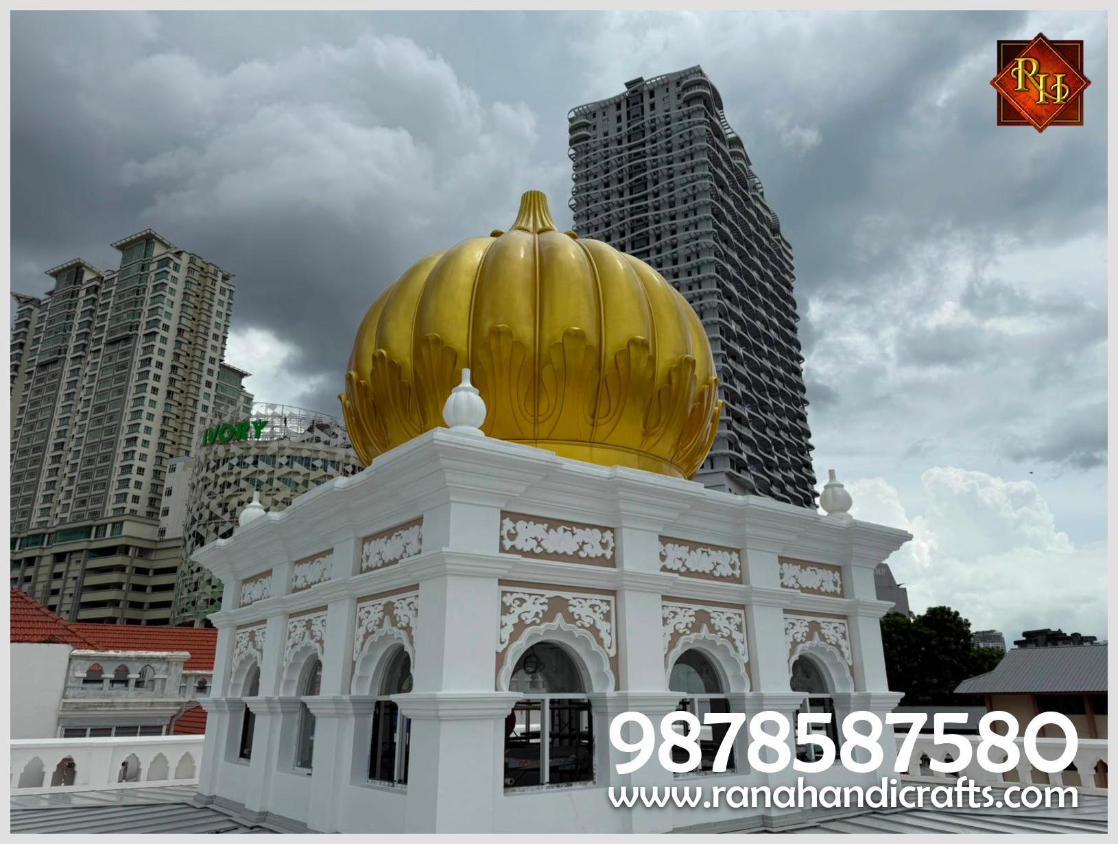 Side profile of the 20ft golden gurdwara dome installed at Wadda Gurdwara Sahib Penang, highlighting its shape and the detailed white structure beneath it.