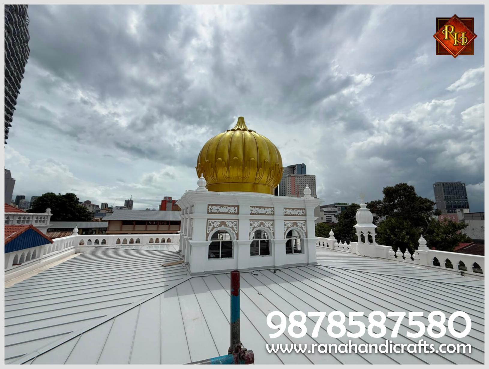 Another profile of the 20ft golden gurdwara dome / gumbad installed at Wadda Gurdwara Sahib Penang, highlighting its shape and the detailed white structure beneath it.