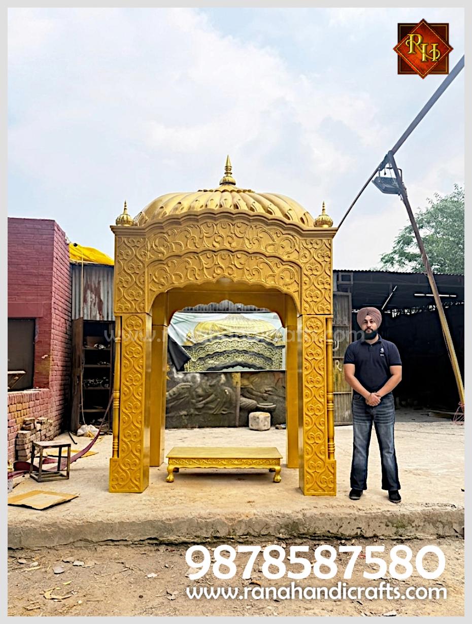 Initial assembly phase of the PK13 Palki Sahib structure at our workshop with Uday Veer Singh (Prop) Standing Next to it.