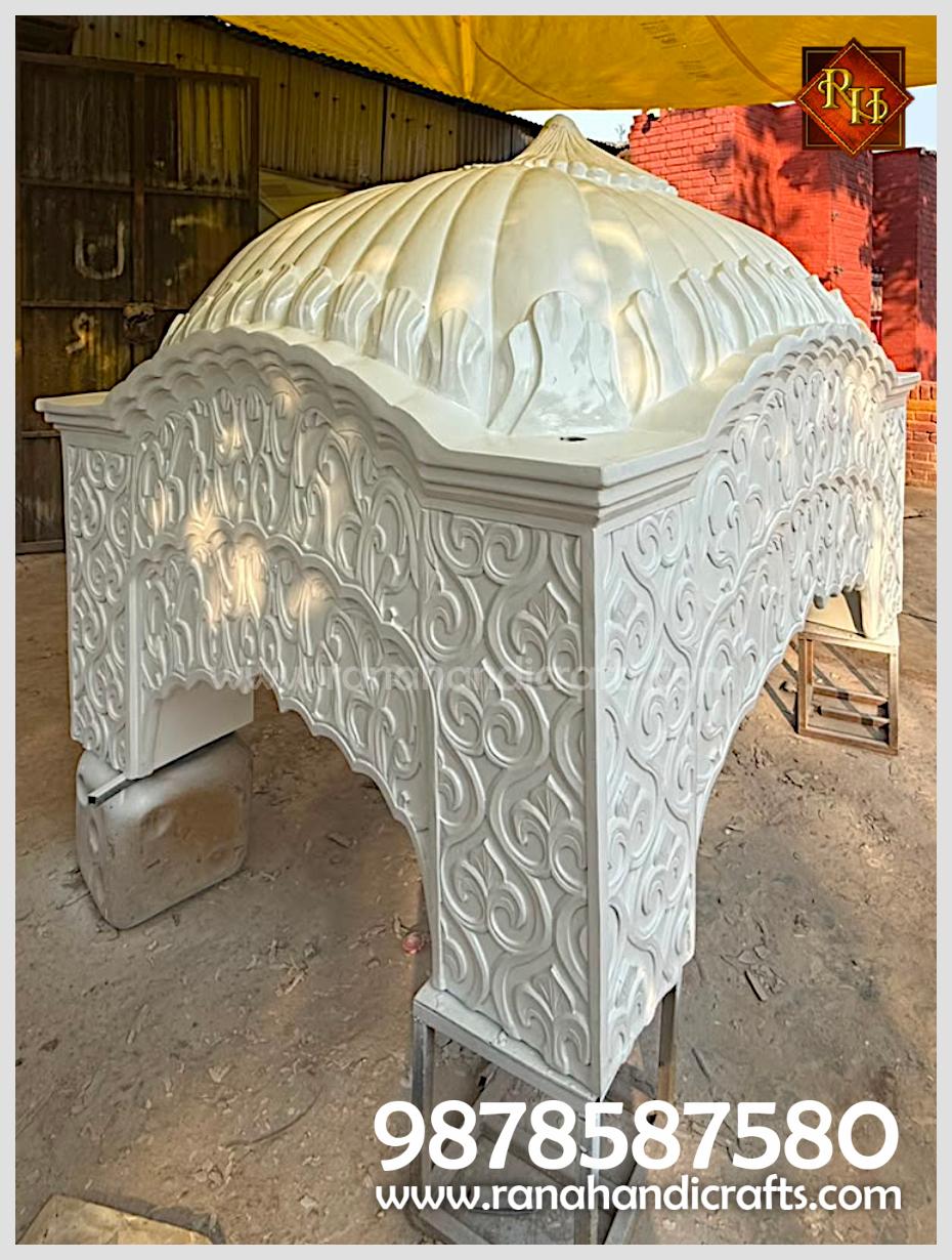 Side profile of the white Palki Sahib dome / gumbad showing the decorative archway and carvings