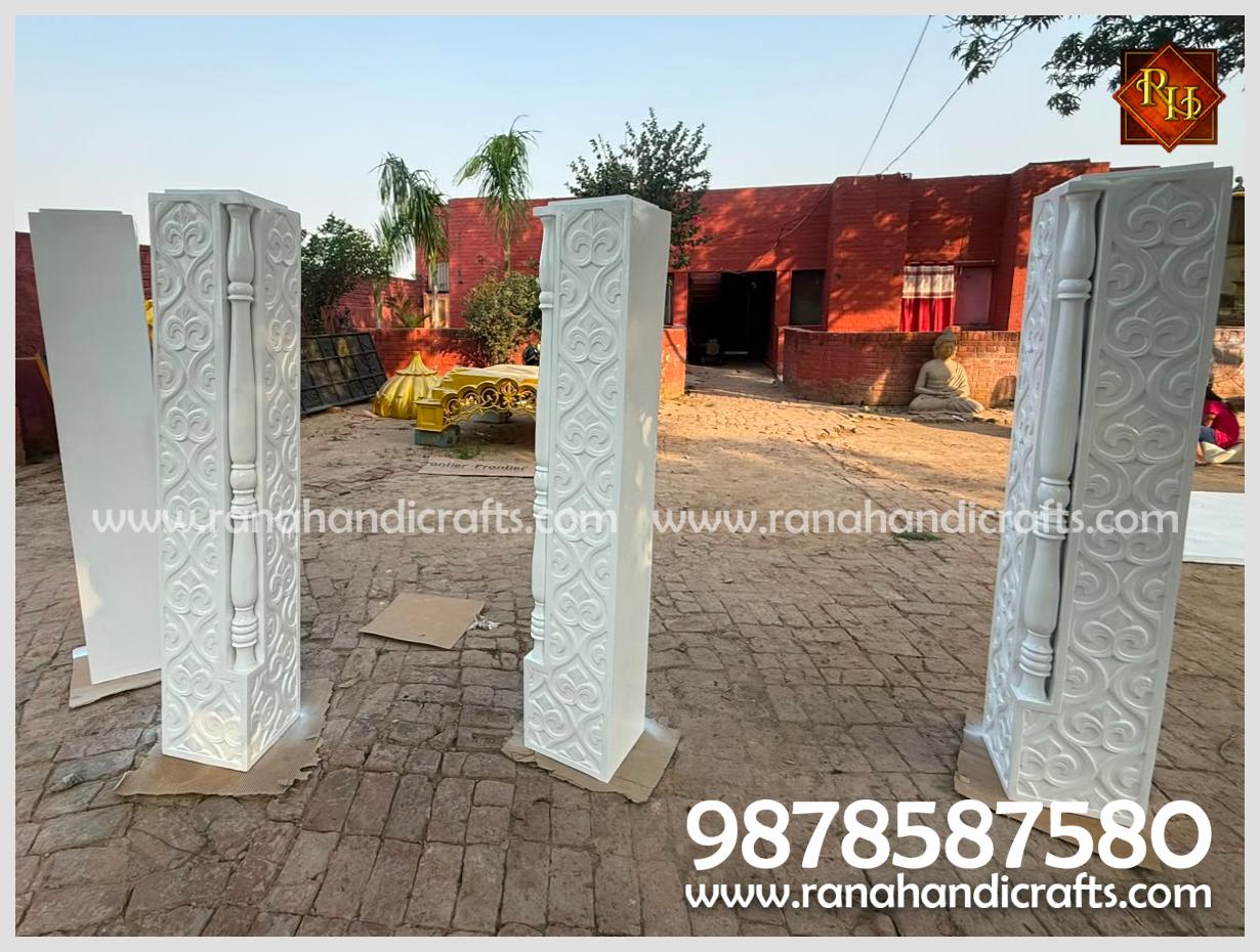 Four 5ft 6inch tall, ornately carved white pillars designed for the Palki Sahib structure for Gurdwara Sahib in UK