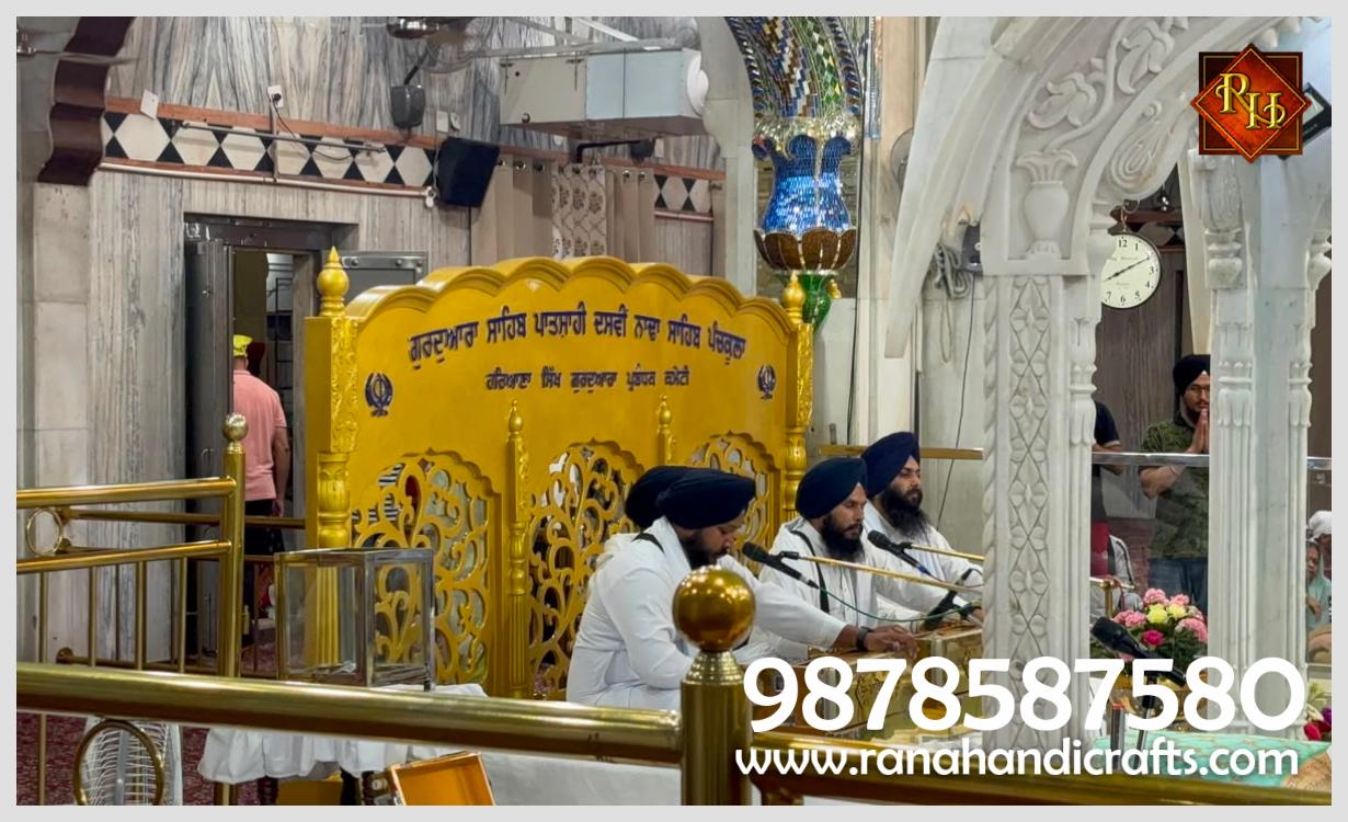 Close-up of a decorative golden Kirtan backdrop screen installed at Nada Sahib Gurdwara, custom-made for durability by Rana Handicrafts International