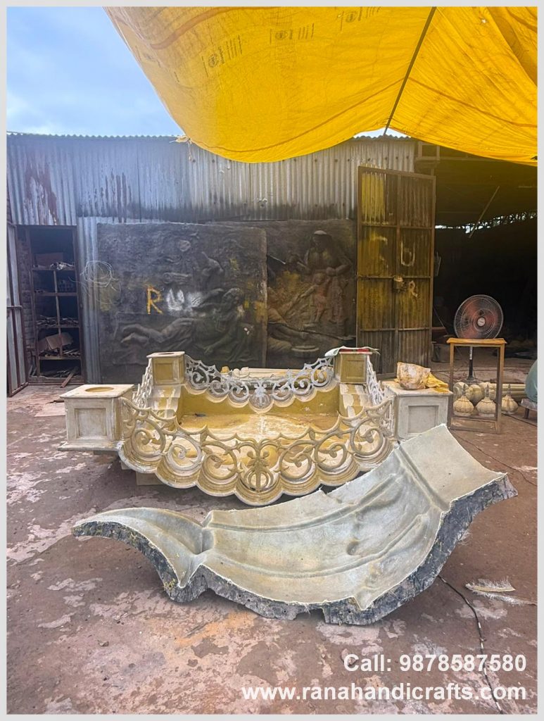Assembled structure of a large 7ftx7ft Palki Sahib for Tanzania, with a detached ornate side panel, in the Rana Handicrafts International workshop using high quality silicon fiber