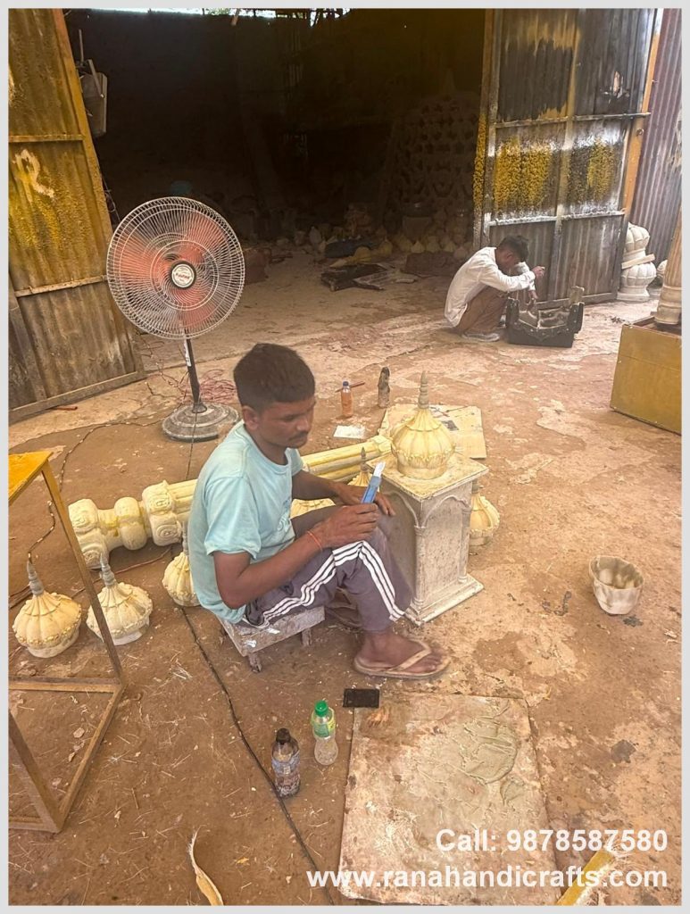 Artisan working on small decorative domes for a Palki Sahib structure in the workshop of Rana Handicrafts International using high quality silicon fiber
