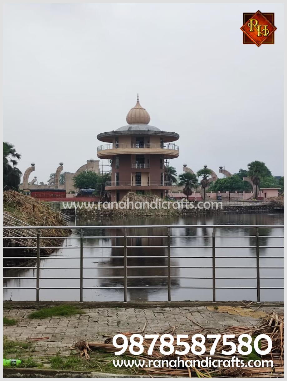 Scenic view overlooking the pond toward the Sikh Library featuring the 14ft diameter dome at Patna Sahib, Bihar, by Rana Handicrafts International.