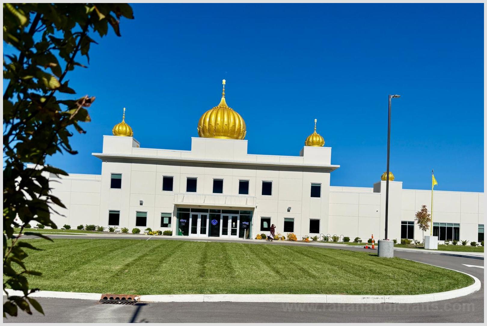 Daylight view of installed golden Gurdwara domes and Nishan Sahib flag pole at Sikh Satsang of Indianapolis USA